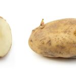 Patate fresche conservate in un contenitore per evitare germogli.